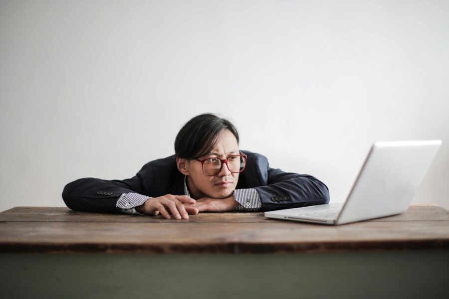 Man sitting in front of his laptop waiting